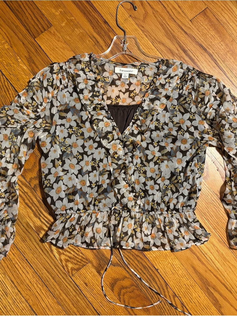 Francesca's Collections. Floral Ruffle V-Neck Sheer Blouse